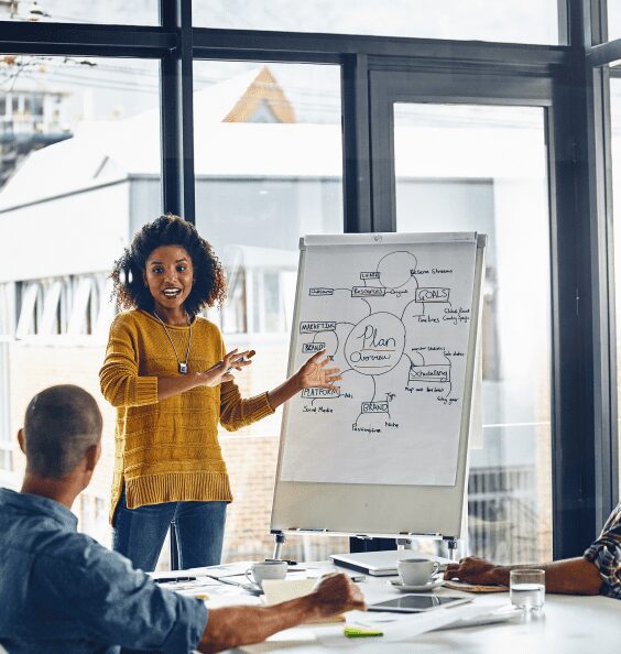 Person presenting business plan to colleagues.