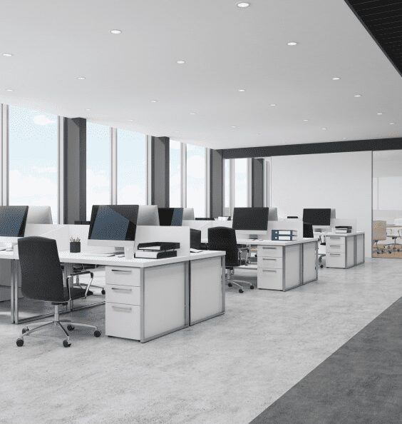 Modern open-plan office with desks and chairs.